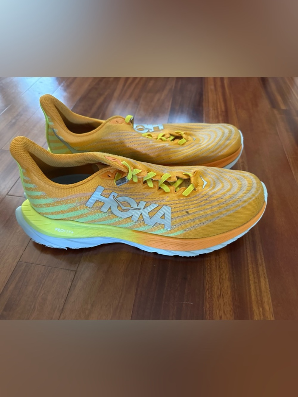 Hoka Orange and Neon Yellow Road Running Shoes
